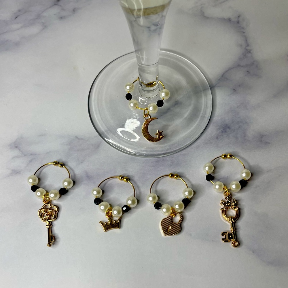 2/$10 ❤️❤️- Black & gold wine charms